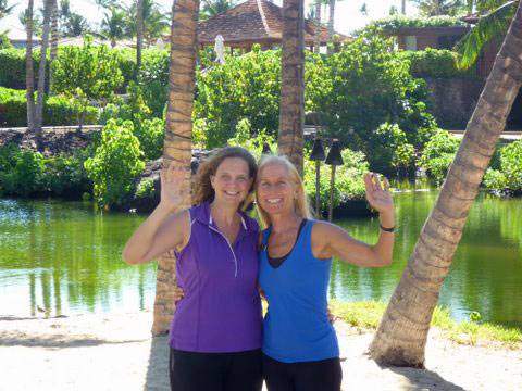 Calley O'Neill with yoga student.